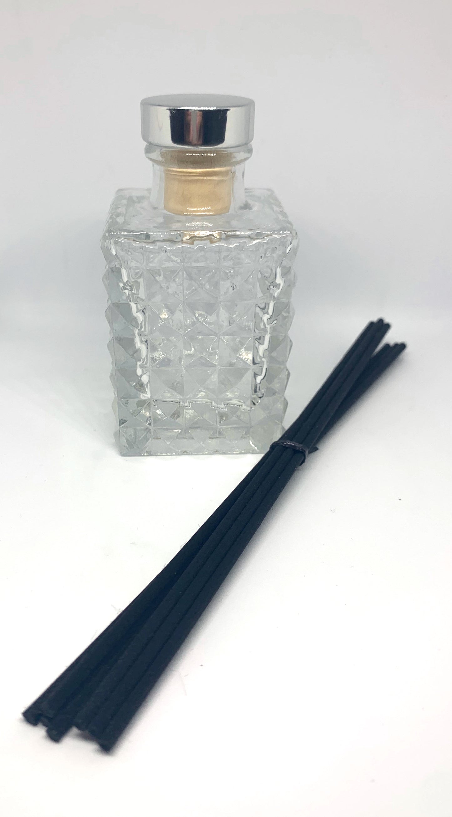 Diamond Reed Diffuser against white background with Black Reeds